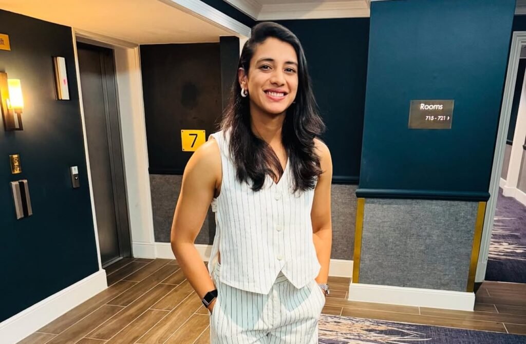 Smriti Mandhana standing in a hotel corridoor